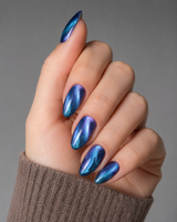 Aurora Blue Cat Eye almond press-on nails worn on a hand