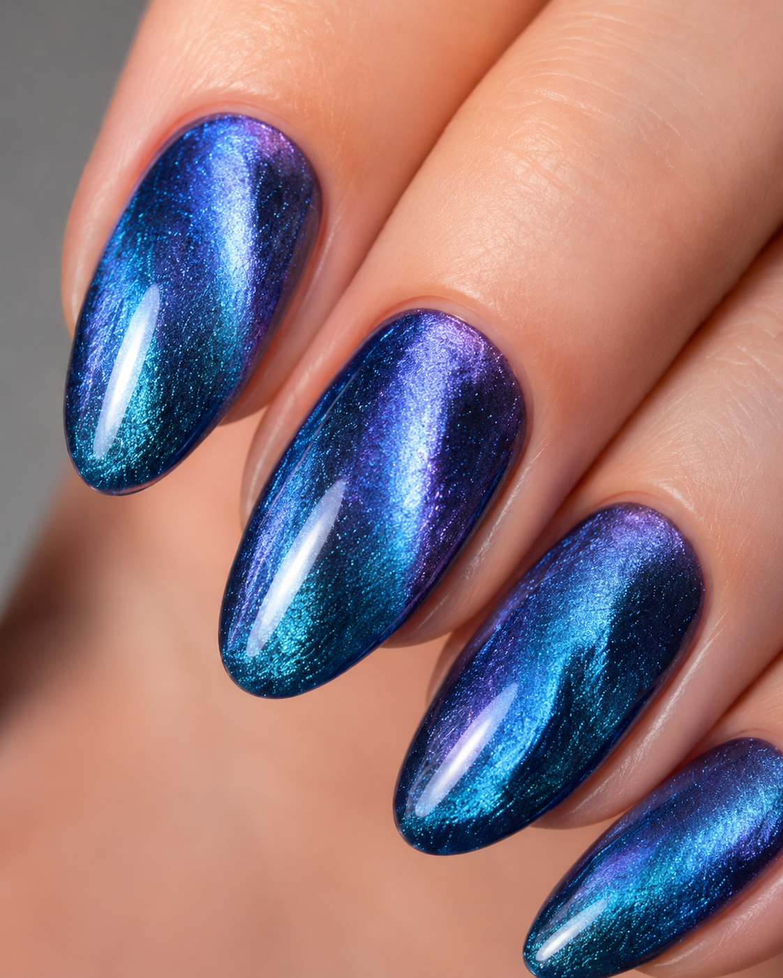 Aurora Blue Cat Eye almond press-on nails from the side