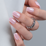 Bare Harmony short squoval press-on nails worn on a hand