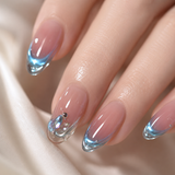 Blue Aura French long almond press-on nails worn on a hand