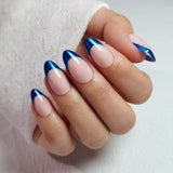 Blue Edge short almond press-on nails worn on a hand