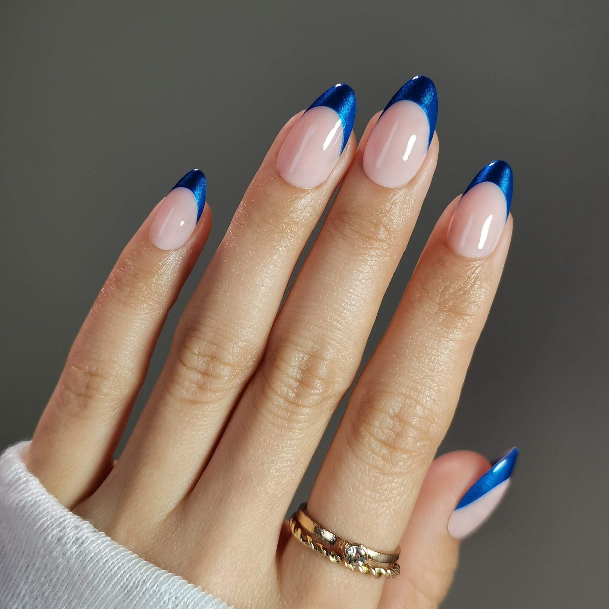 Blue Edge short almond press-on nails from the side