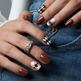 Blush Leopard short squoval press-on nails worn on a hand