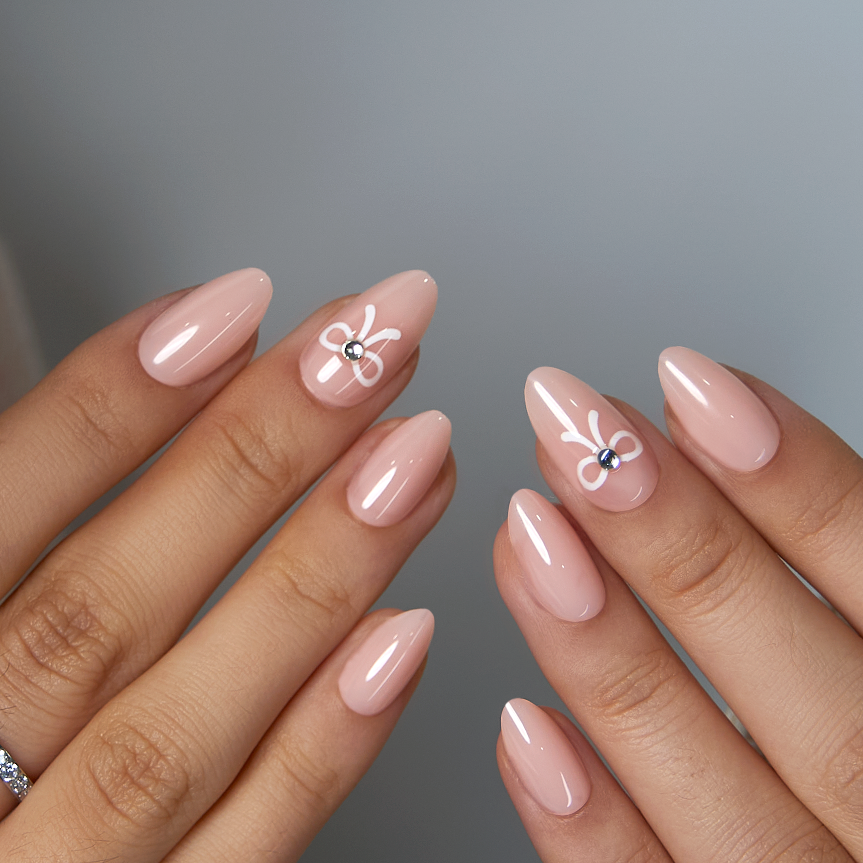 Bowkiss short almond press-on nails worn on a hand