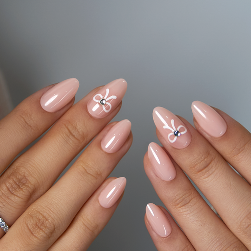 Bowkiss short almond press-on nails worn on a hand