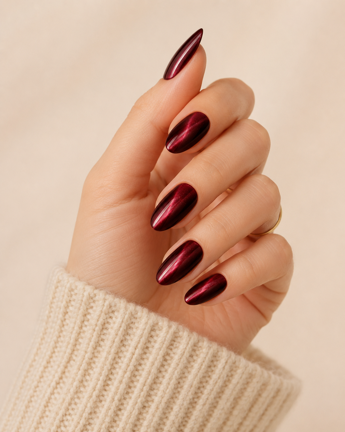 Burgundy Velvet medium almond press-on nails worn on a hand