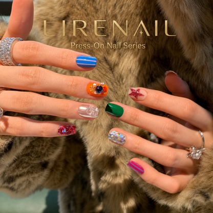 Candy Party press-on nails worn on hands with colorful striped, glittery and star-accented designs