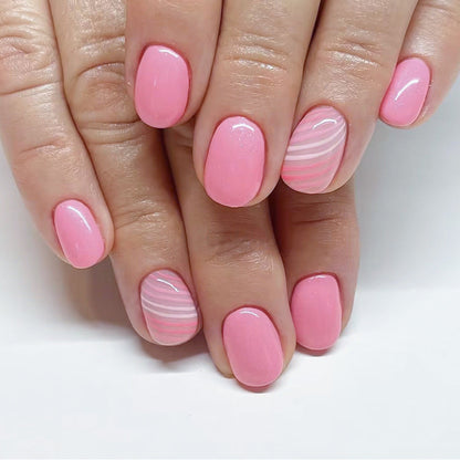 Candy Stripe Rs squoval press-on nails worn on a hand