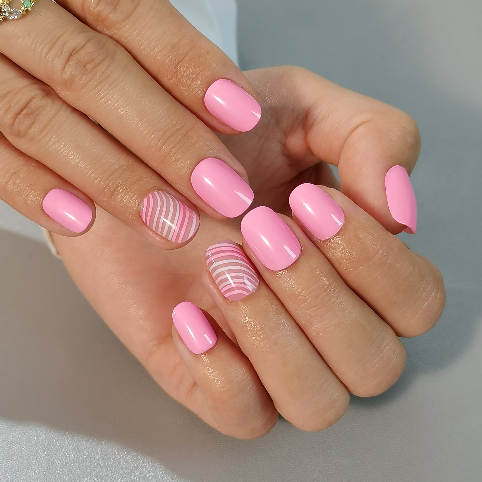 Candy Stripe Rs squoval press-on nails from the side