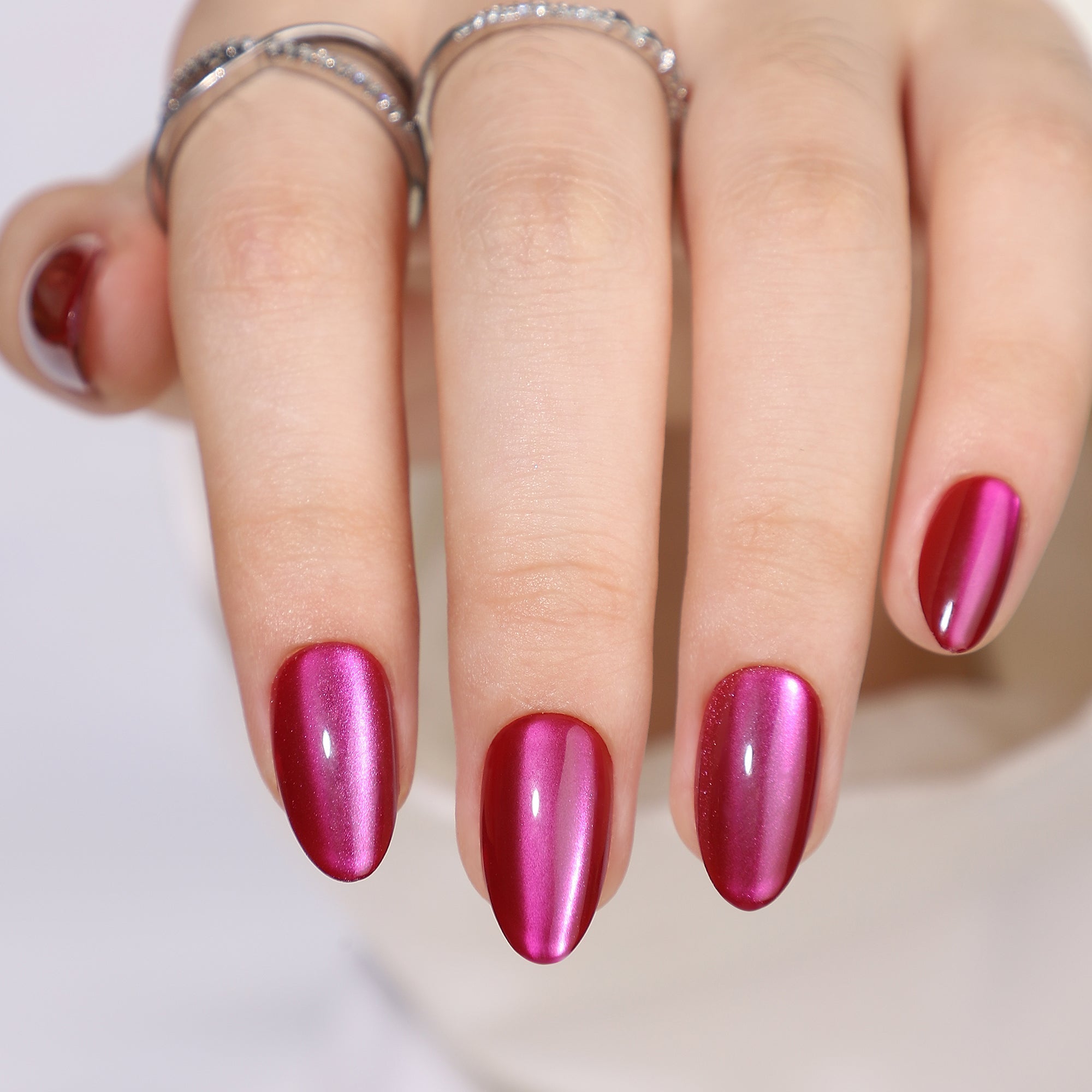 Cherry Chrome short almond press-on nails from the side