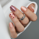 Chestnut Plaid short squoval press-on nails worn on a hand