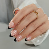 Classic Polka short almond press-on nails worn on a hand