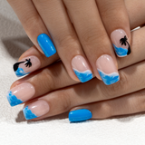 Coconut Palm short squoval press-on nails worn on a hand