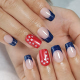 Colorful Stars short squoval press-on nails worn on a hand