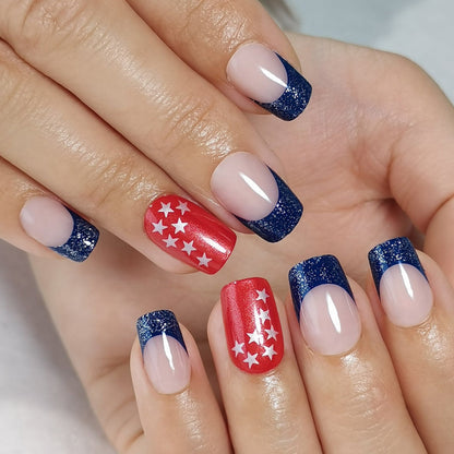 Colorful Stars short squoval press-on nails worn on a hand