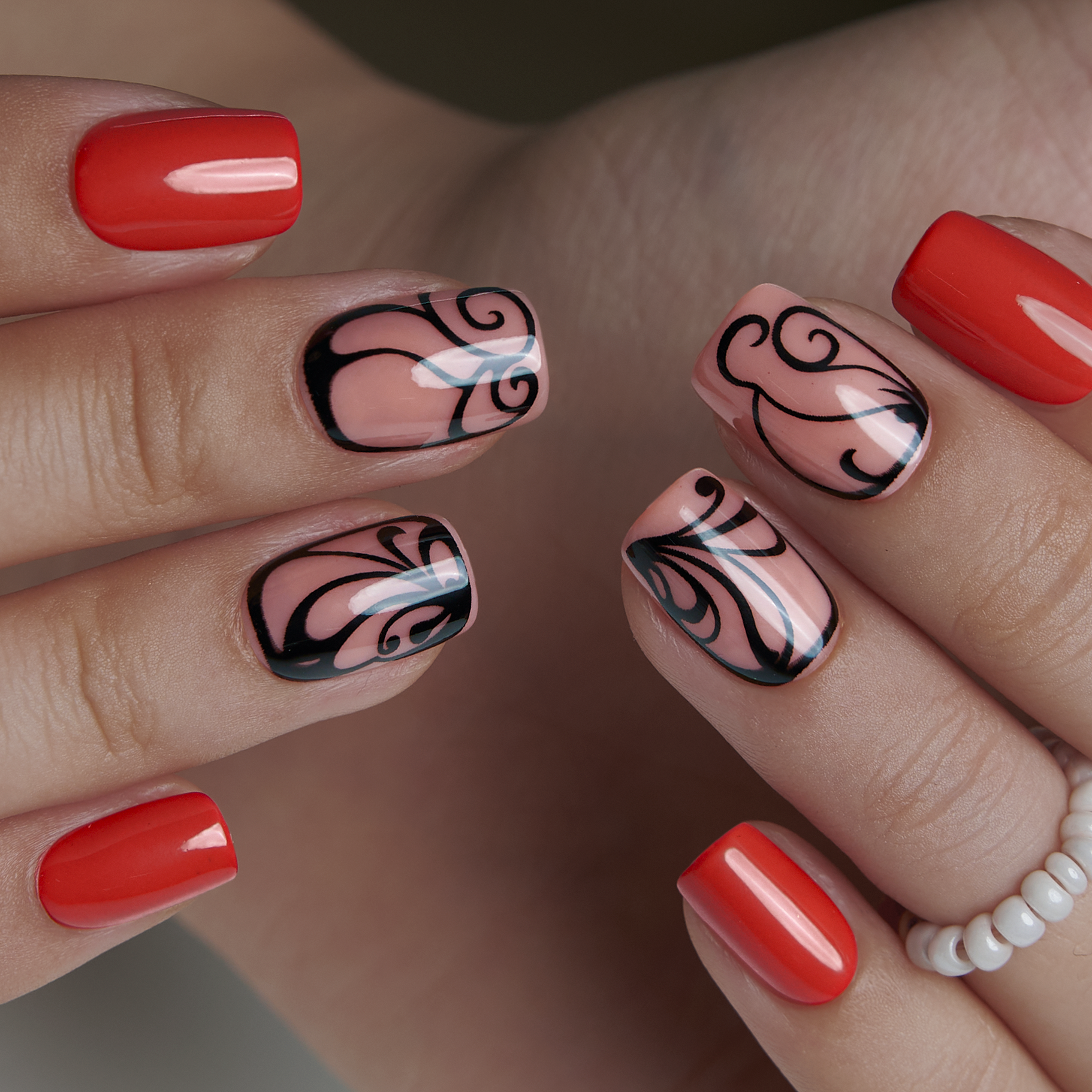 Crimson Artistic short squoval press-on nails worn on a hand