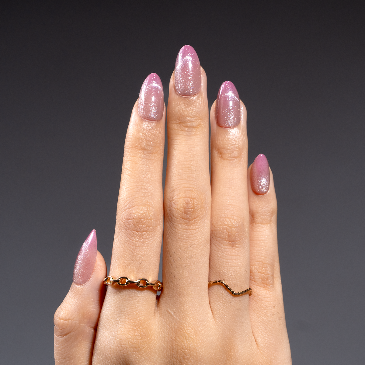 Crystal Dream short almond press-on nails worn on a hand