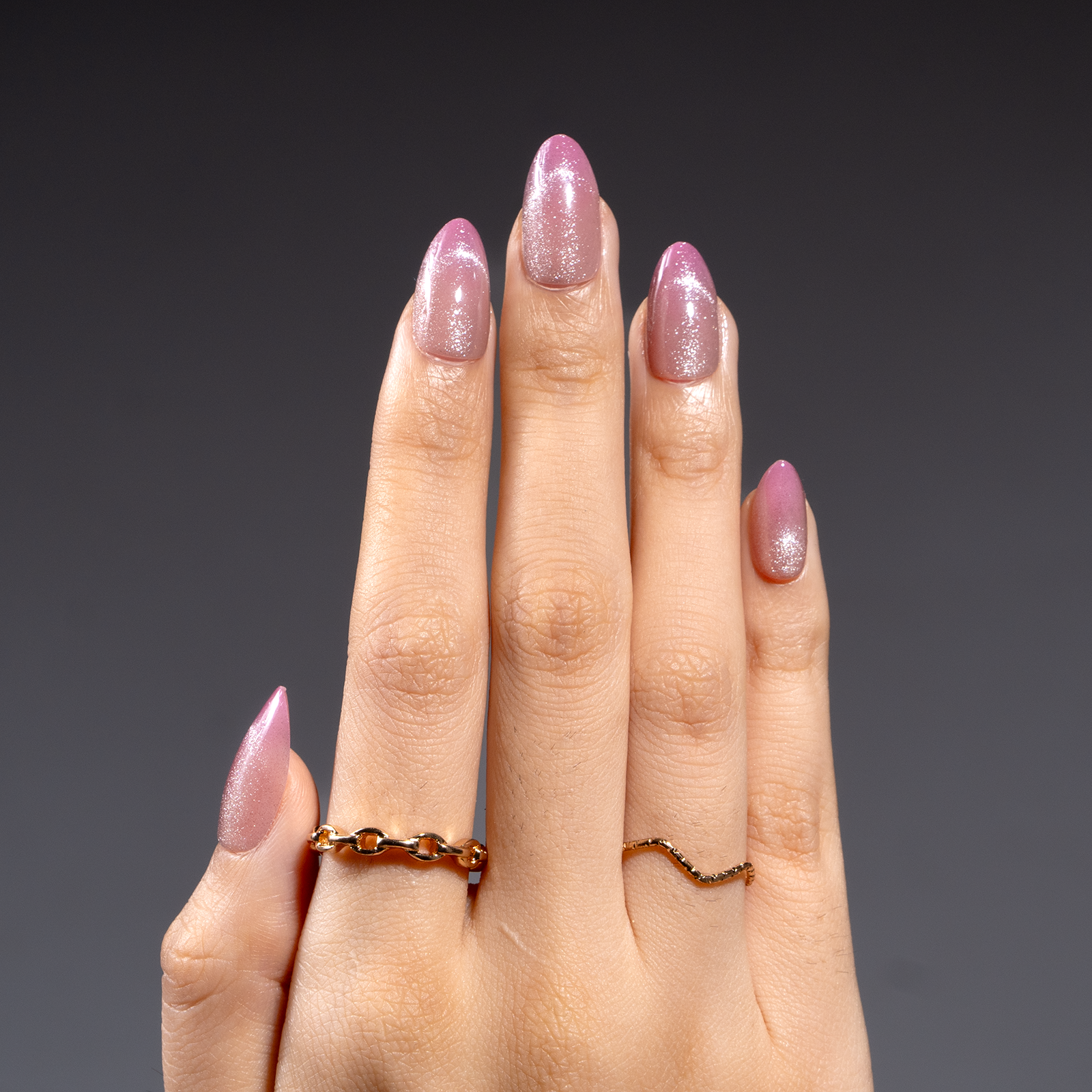 Crystal Dream short almond press-on nails worn on a hand