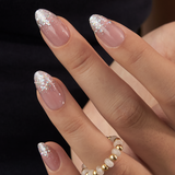 Crystal Drip short almond press-on nails worn on a hand