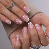 Crystal Whisper short squoval press-on nails worn on a hand