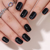 Dark Silky Shine Rs squoval press-on nails worn on a hand