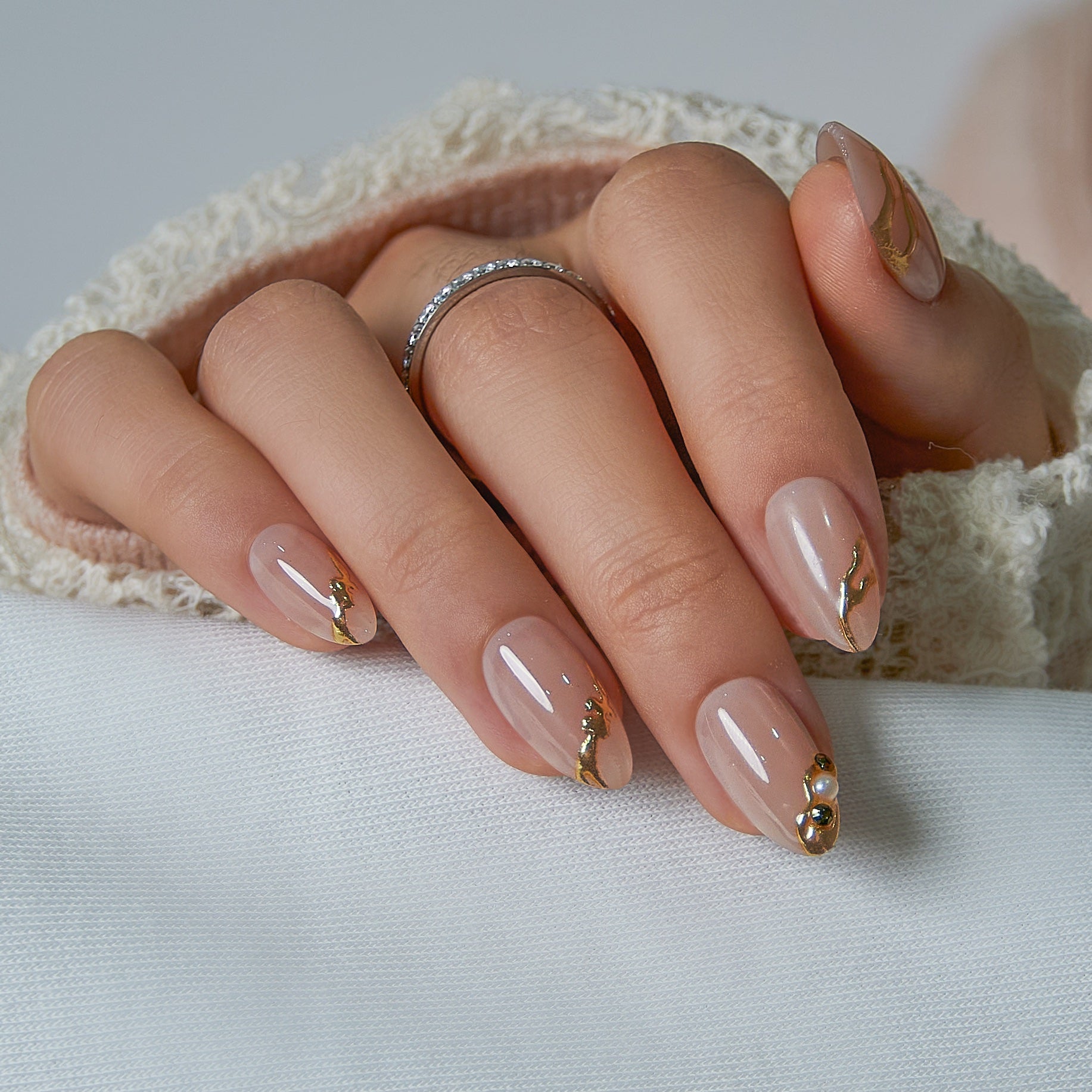 Designer S Pick Diamond Nude short almond nail detail