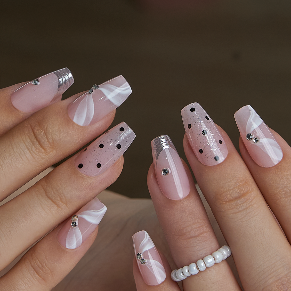 Designer S Pick Elegant Mirage M Coffin press-on nails worn on a hand