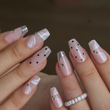 Designer S Pick Elegant Mirage M Coffin press-on nails worn on a hand