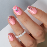 Designer S Pick Weet Bow Sparkle medium squoval press-on nails from the side