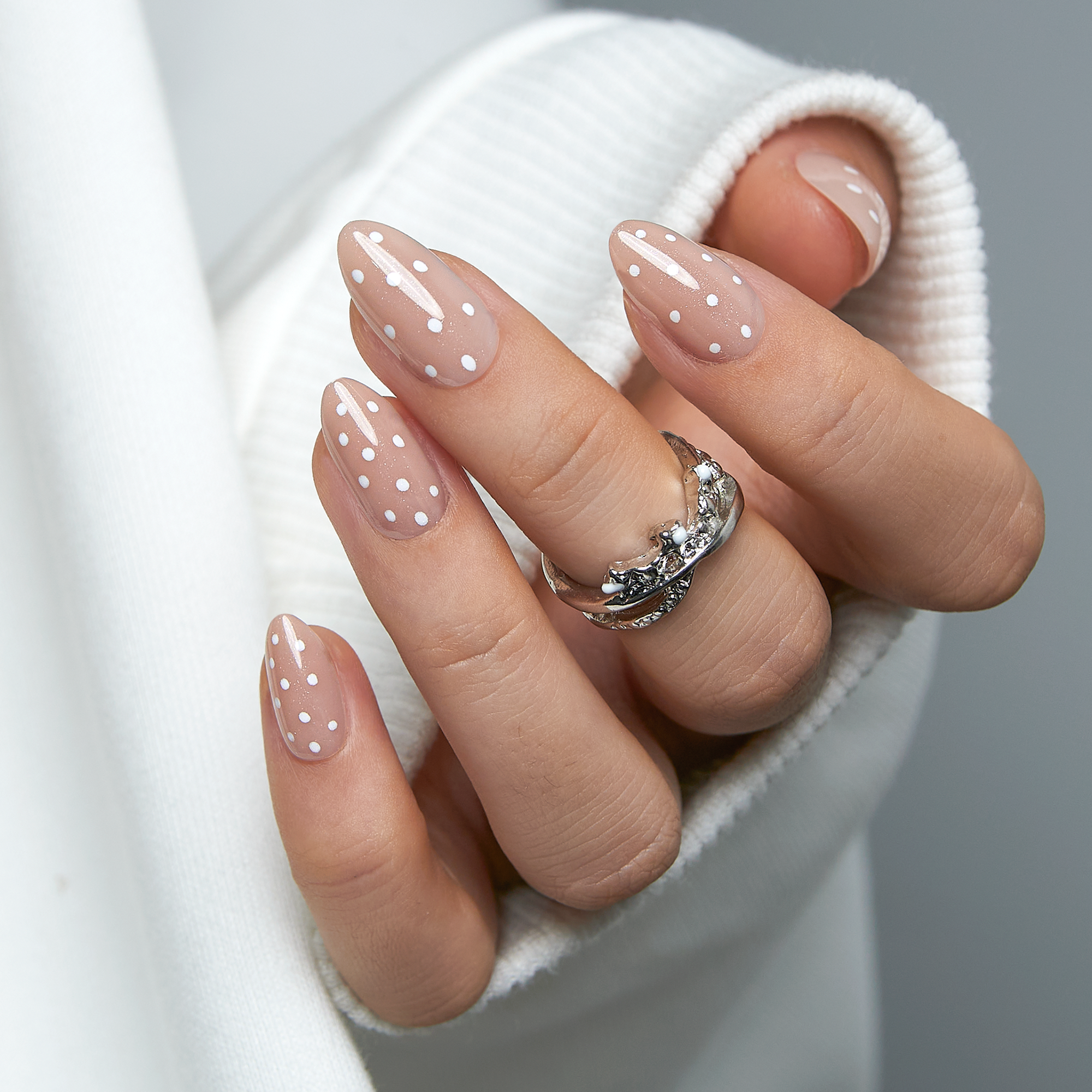 Dotted Milk Glow short almond nail detail