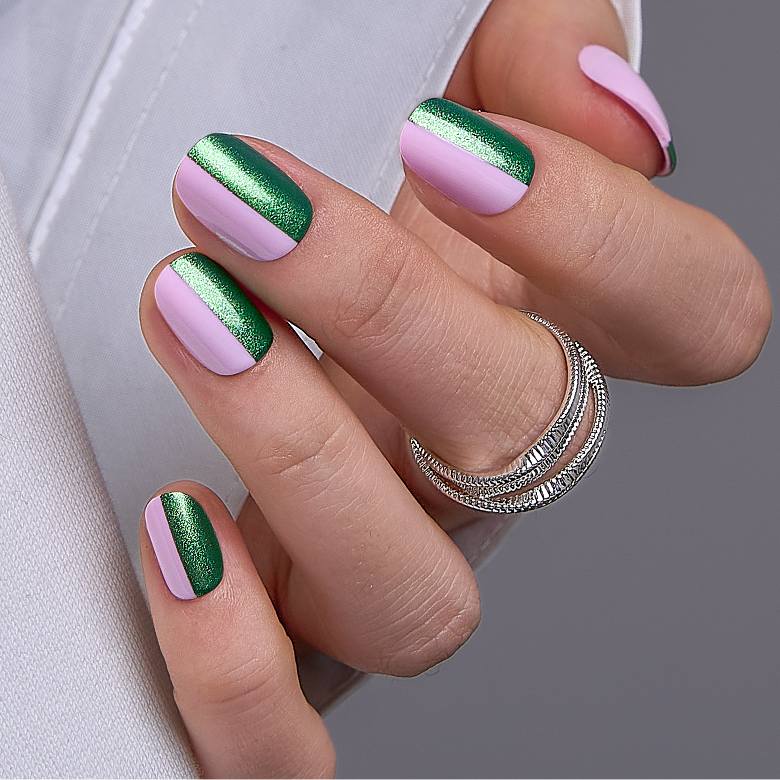 Dual Charm Rs squoval press-on nails worn on a hand