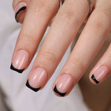 Elegant Noir short squoval press-on nails worn on a hand