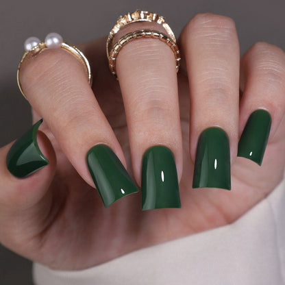Emerald Pure M Duckbill press-on nails worn on a hand