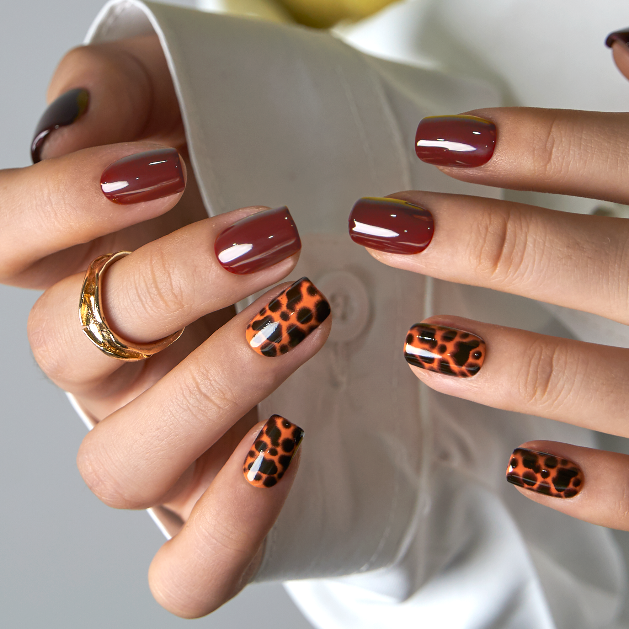 Fierce Chic short squoval press-on nails worn on a hand