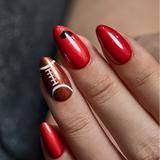Football Game short almond press-on nails worn on a hand