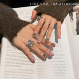 Galaxy Dream press-on nails styled with jewelry