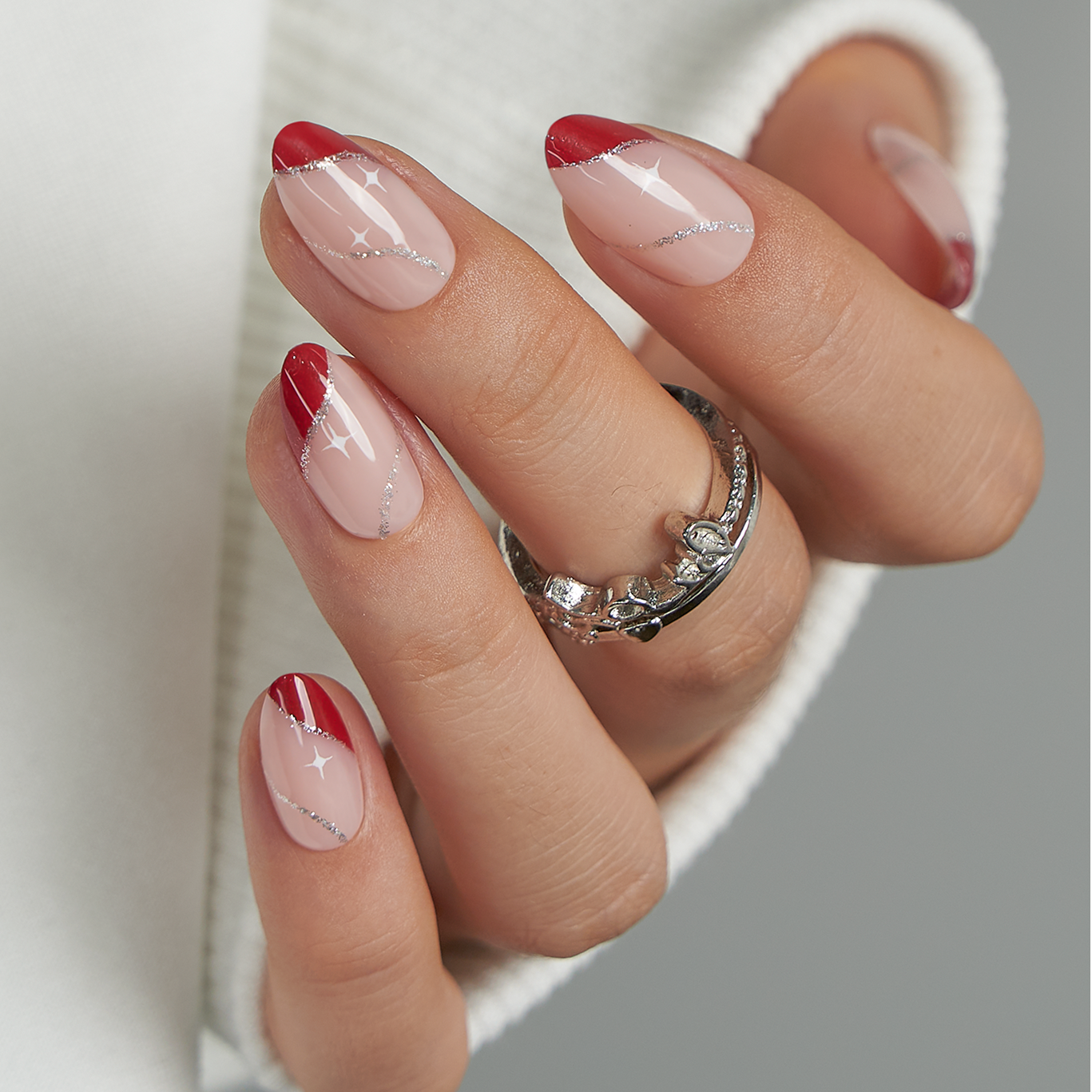 Glitter Star short almond press-on nails worn on a hand