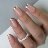Golden French medium squoval press-on nails from the side