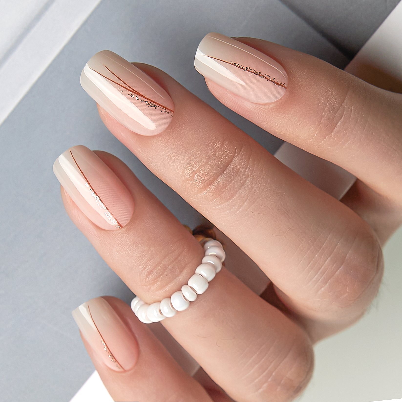 Golden Veil medium squoval press-on nails from the side