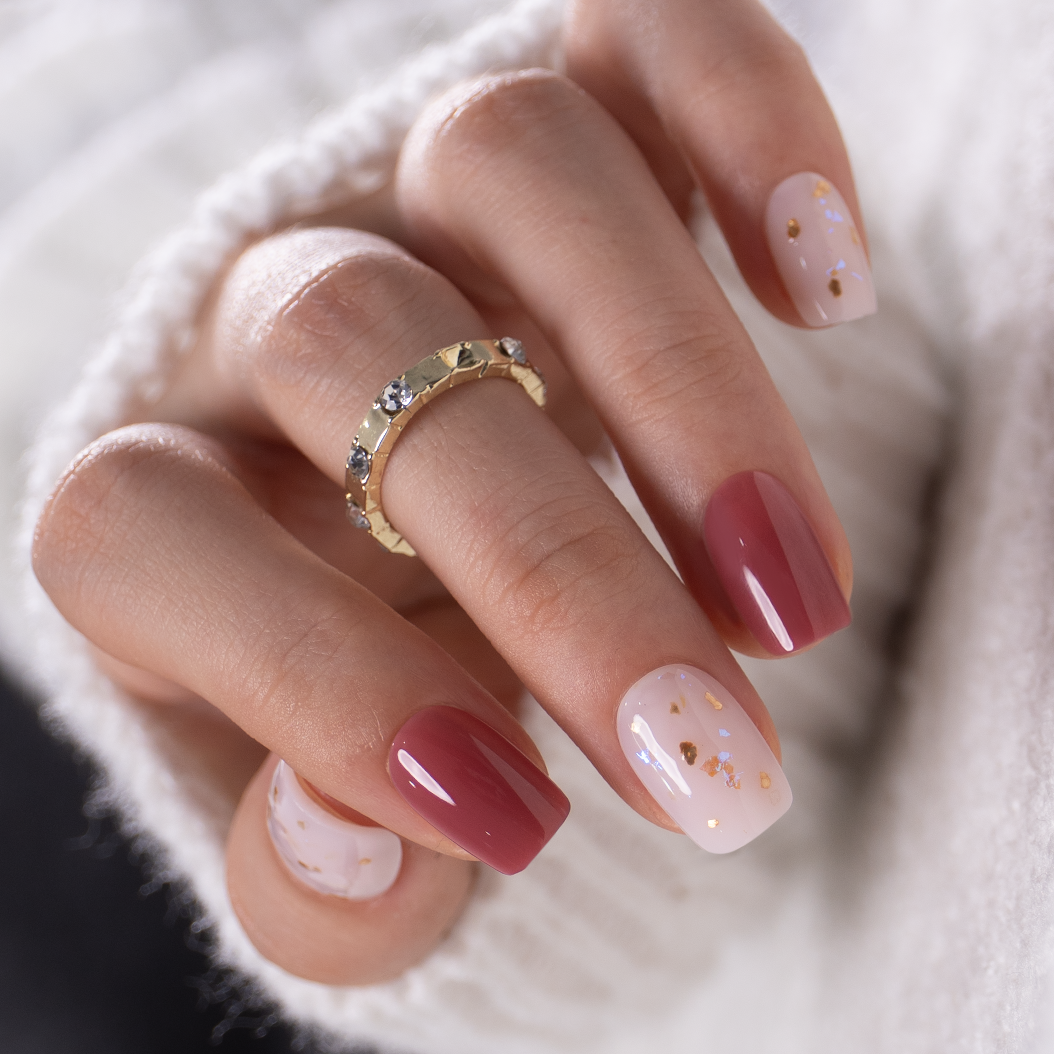 Honey Drift short squoval press-on nails worn on a hand