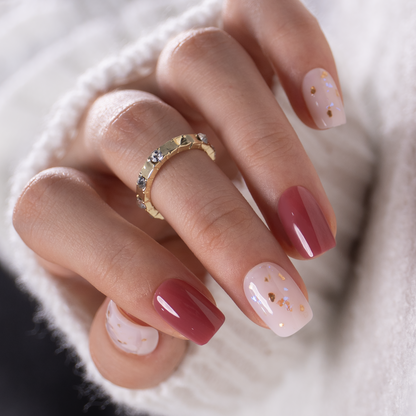Honey Drift short squoval press-on nails worn on a hand
