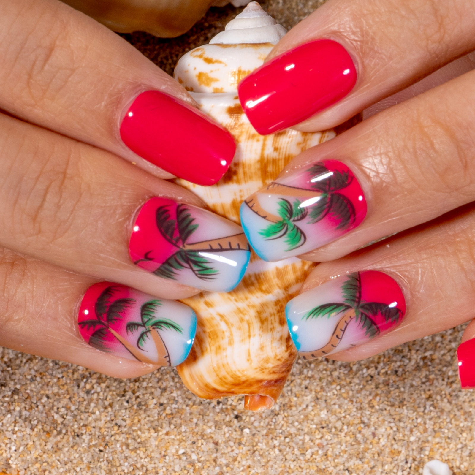 Island Glow short squoval press-on nails worn on a hand