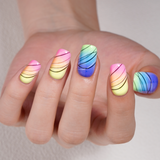 Jumping Lines medium squoval press-on nails worn on a hand