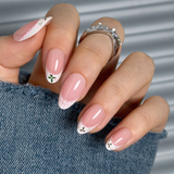 Lace Bloom short almond press-on nails worn on a hand