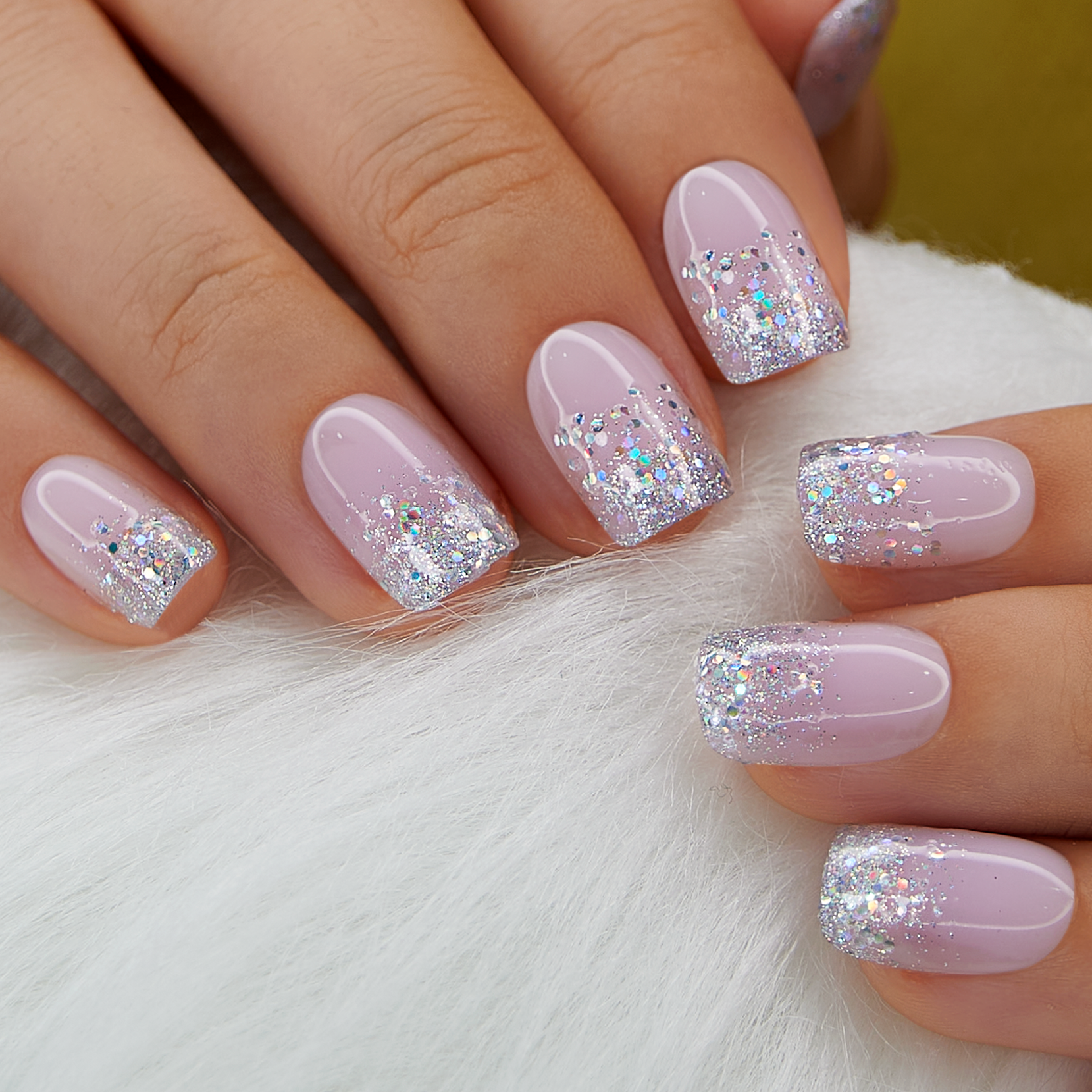 Light Purple short squoval press-on nails worn on a hand