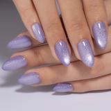 Lilac Shimmer short almond press-on nails worn on a hand