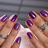 Midnight Amethyst Rs squoval press-on nails worn on a hand