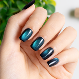 Midnight Galaxy short squoval press-on nails worn on a hand