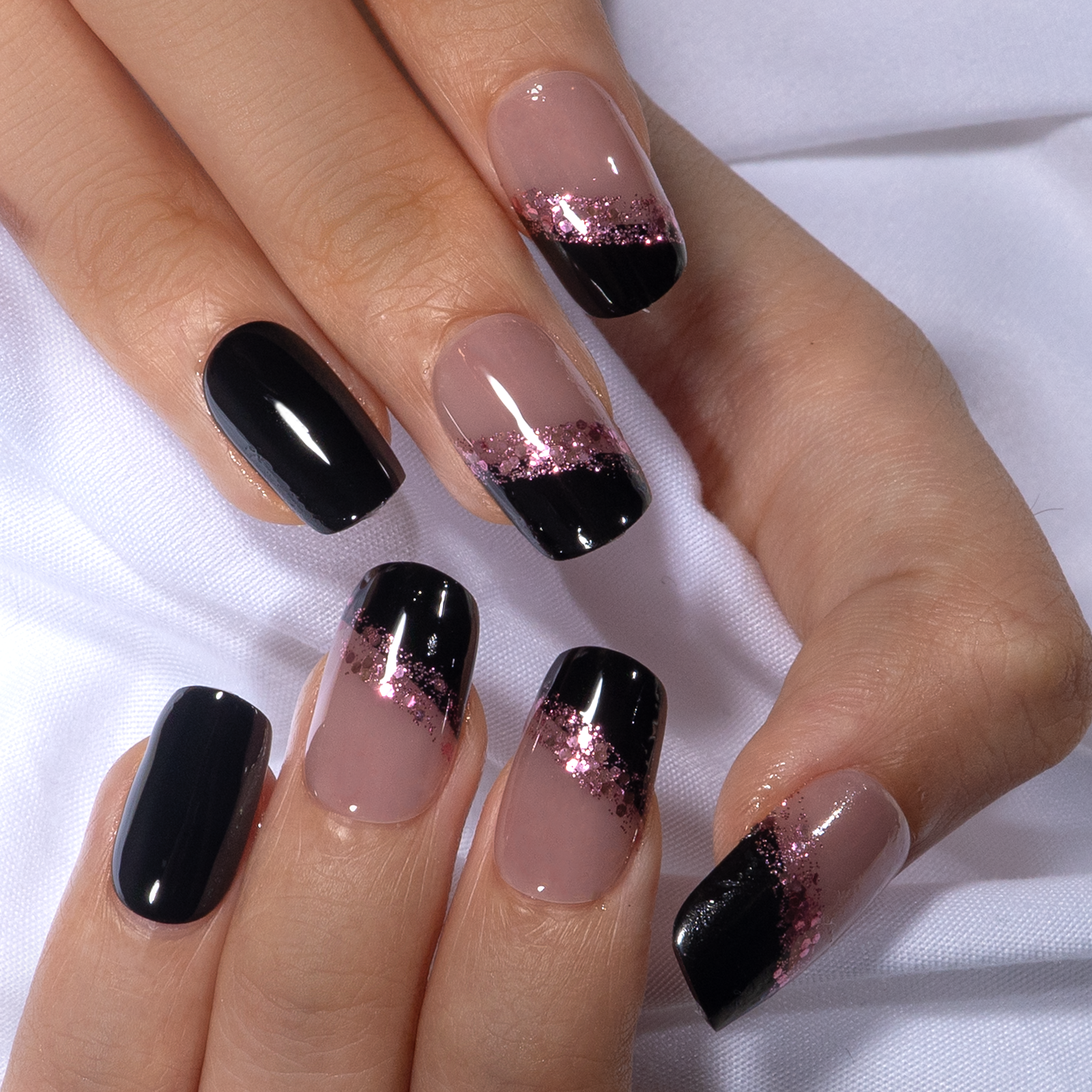 Midnight Shard medium squoval press-on nails worn on a hand