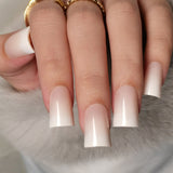 Milky Dream Fade M Duckbill press-on nails worn on a hand